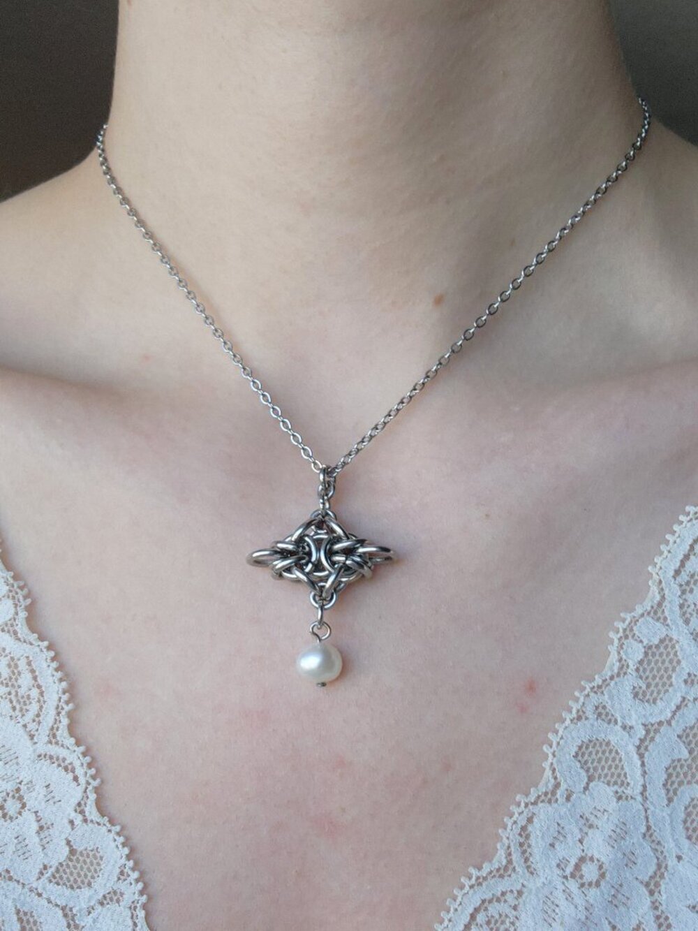 Silver star and pearl drop necklace with a small silver chain